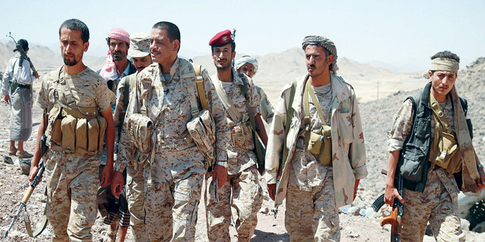  أفراد من الجيش الوطني اليمني وهم يواجهون الانقلابيين