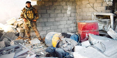  القوات العراقية تطهر مباني حي التنك من جثث عناصرداعش بعداستعادته