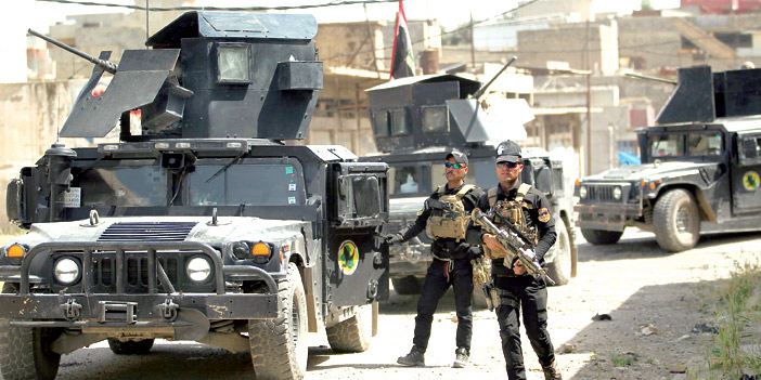  القوات العراقية أثناء اشتباكها مع داعش بالموصل