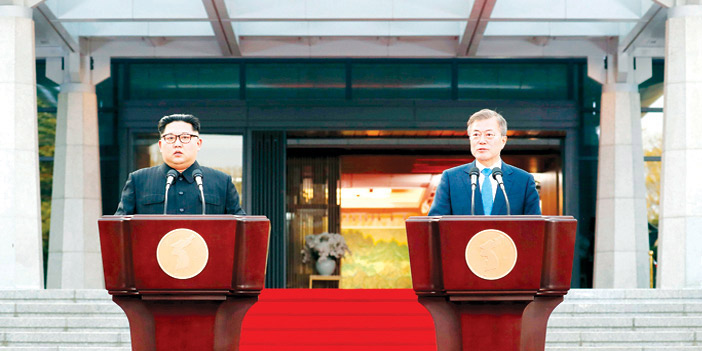  رئيسا الكوريتين أثناء إلقاء خطابيهما