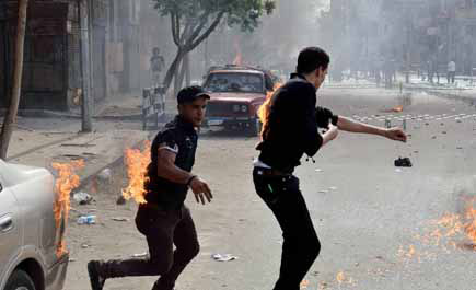 قتيل في صدامات استهدفت الأقباط في القاهرة عقب جنازة غاضبة ضد مرسي 