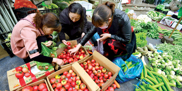 نساء في متجر خضار جنوب الصين 