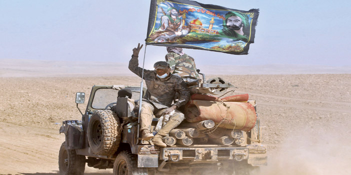 القوات العراقية ملونة بالشعارات الطائفية قرب الموصل