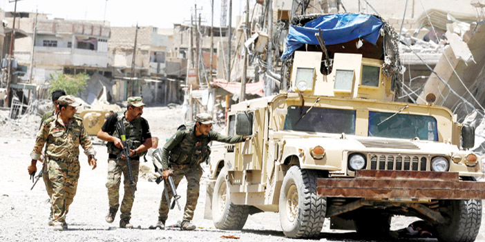  القوات العراقية أثناء مواجهة عناصر تنظيم داعش