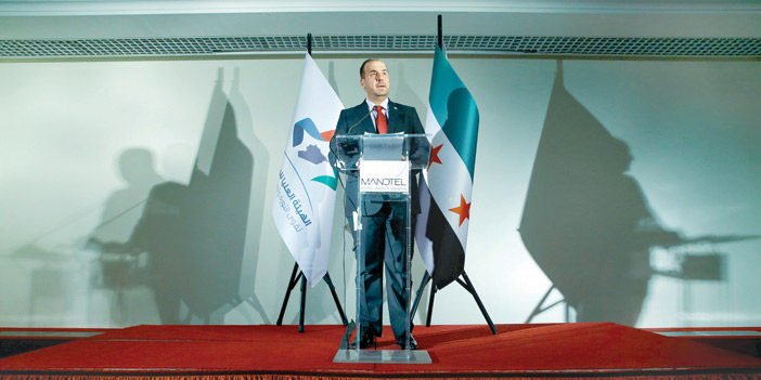  نصر الحريري رئيس وفد المعارضة السورية في مؤتمر صحفي بجنيف