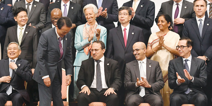  وزير المالية محمد الجدعان ومحافظ مؤسسة النقد خلال اجتماعات مجموعة العشرين
