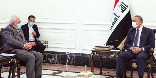  رئيس الحكومة العراقية خلال لقاء وزير الخارجية الإيراني في بغداد