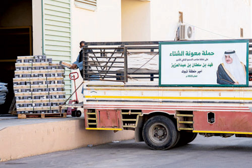  توزيع معونات الشتاء في منطقة تبوك